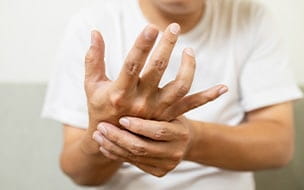 Man massages hand